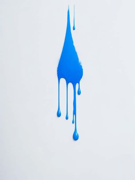 Premium Photo Blue Paint Drops On White Wall