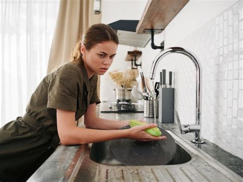 Premium Photo Side View Of Young Woman Sitting In Kitchen