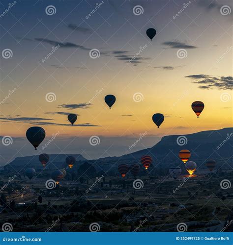 Hot Air Balloons Fly Over The City Of Goreme At Sunrise Editorial Image