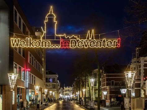 Download Welkomin Deventer Evening Lights Wallpaper | Wallpapers.com