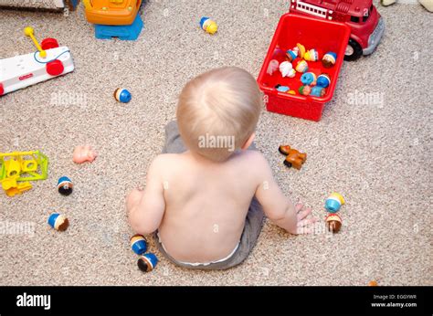 Child playing with toys Stock Photo - Alamy