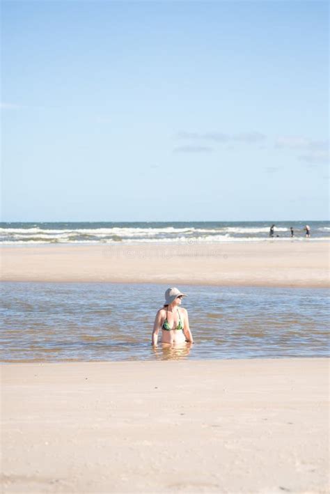 Woman In A Bikini And Hat Relaxing In The Sea Stock Photo Image Of Holiday Fashion