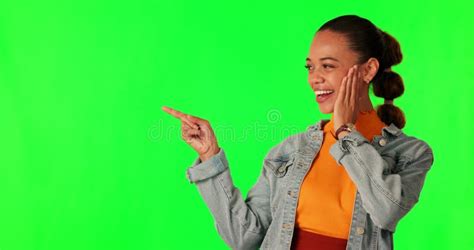 Surprise Pointing And Woman In Studio With Green Screen And Mockup