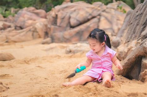 Asian Girl Playing Sand In Playground Cute Child Happy Preschool