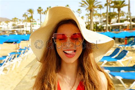 Sexy Bikini Woman Walking On Wooden Plank Between Umbrellas And Stock Photo Crushpixel