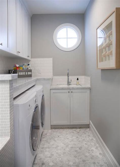 White And Gray Laundry Room With Beveled Subway Tiles Transitional