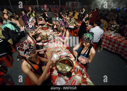 Bikini Dressed Models Wearing Peking Opera Headgears Perform During A