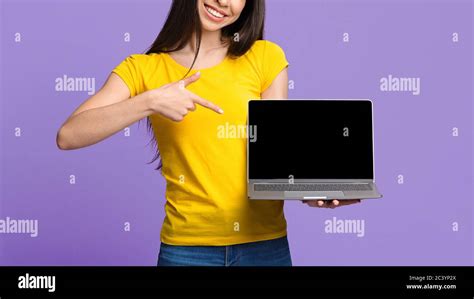 Online Offer Unrecognizable Asian Girl Pointing At Laptop With Black