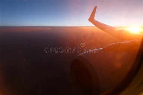 Sunset sky on airplane, plane window.view through sunset window of an ...