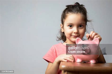 Kids With Piggy Banks Photos and Premium High Res Pictures - Getty Images