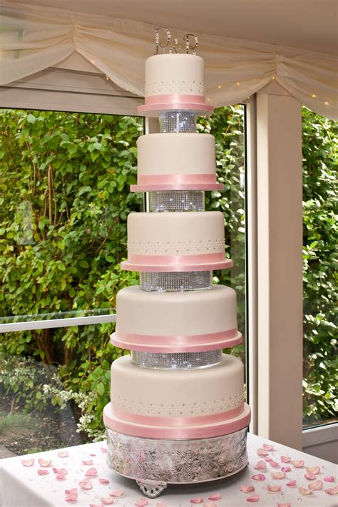 5 Tiered Double Height Cakes With Clear Separators Between Filled