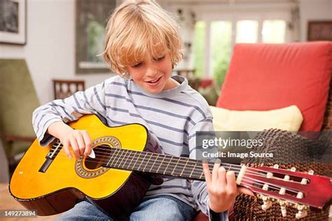 Kids Playing Guitar Photos and Premium High Res Pictures - Getty Images