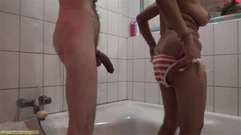 Asian Mature Plays With Cock While Showering