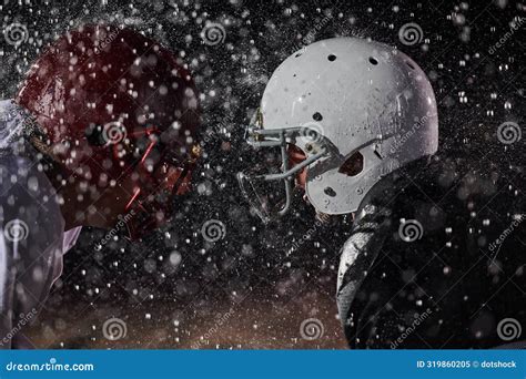 Two American Football Players Face To Face In Silhouette Shadow On