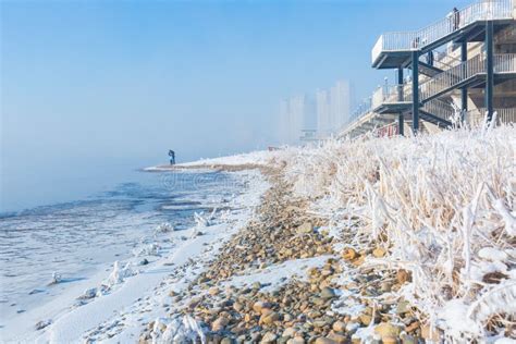 Fog on Songhua River and Tall Buildings in Fog on Both Sides of the River after Snow in Jilin ...