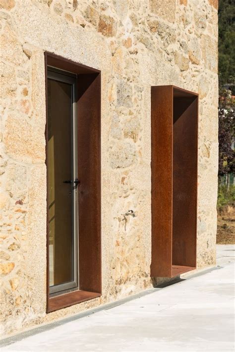 Two Open Windows On The Side Of A Stone Building