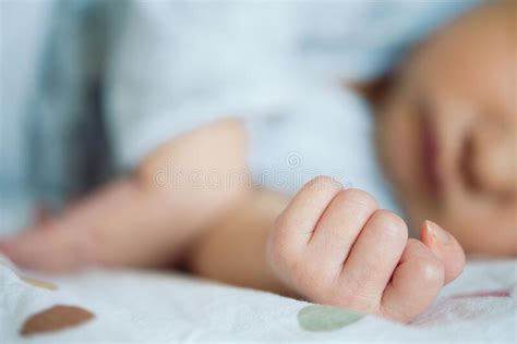 Hand Of Newborn Baby Resting On Bed Stock Photo Image Of Calm Lying