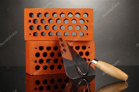 Metal tool for building and bricks isolated on black Stock Photo by ...