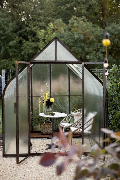 Premium Photo Vintage Greenhouse In Backyard