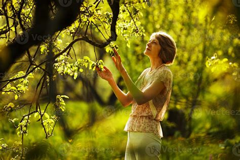 Beautiful older woman in the garden 3512908 Stock Photo at Vecteezy