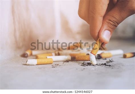 Hand Putting Out Cigarettecigarette Butt On Stock Photo