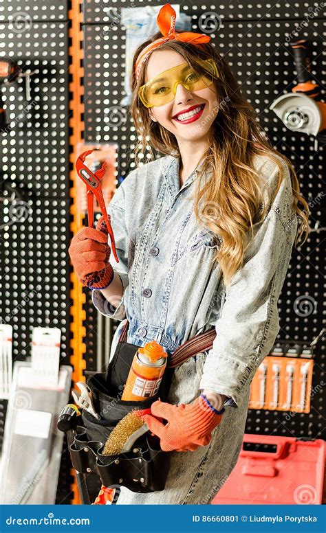Portrait Of The Attractive Salesgirl With Long Blonde Hair And Yellow Glasses In Home