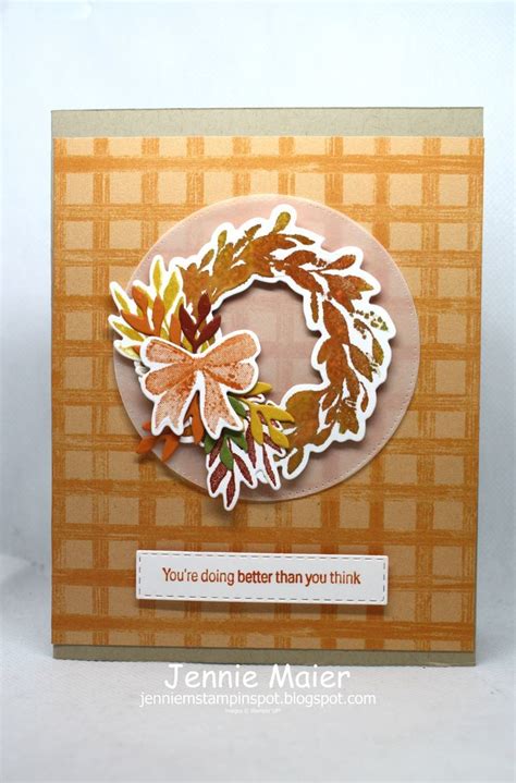 A Close Up Of A Card With A Wreath On It