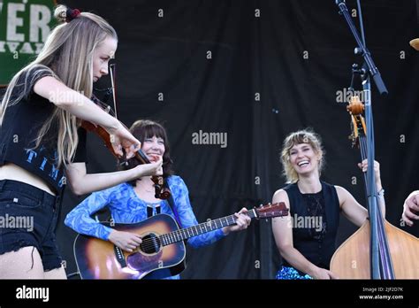 Molly Tuttle and Golden Highway are shown performing on stage during a ...