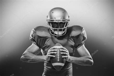 American football player holding ball — Stock Photo © Wavebreakmedia ...