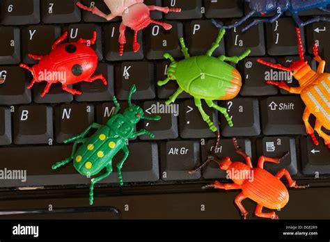 computer bugs on keyboard - concept of computer bug, computer virus infection Stock Photo - Alamy