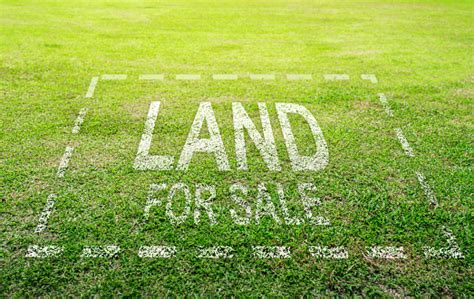 Land Plot Management Real Estate Concept With A Vacant Land On A Green Field Available For