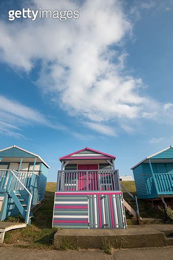 Colourful Wooden Beach Huts Facing The Ocean At Whitstable Coast Kent