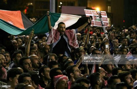 Protesters Hold A Flag During A Demonstration Outside The Prime News