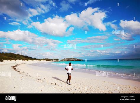 Running in Bermuda Horseshoe Bay Beach Stock Photo - Alamy