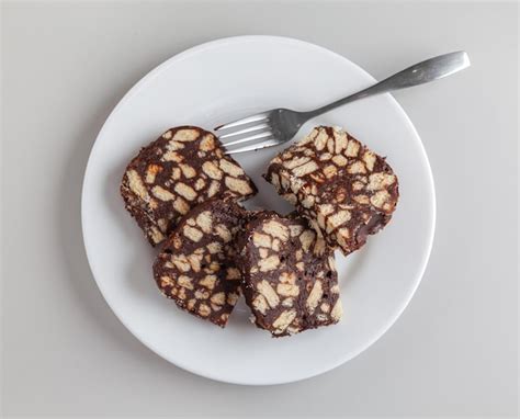 Premium Photo Biscuit And Chocolate Cake Slices On White Plate Top View