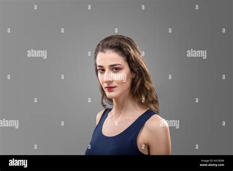 Studio Portrait Of Brunette Woman Isolated Over Gray Background Stock Photo Alamy