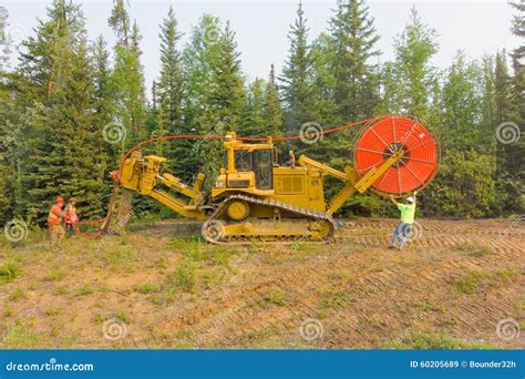 Workers Laying Fibre Optic Cable In The Northwest Territories Editorial