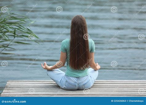 Teenage Girl Meditating Near River Back View Stock Image Image Of