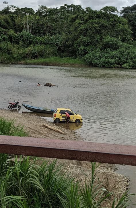 Some guy washing his taxi in a river : r/mildlyinteresting