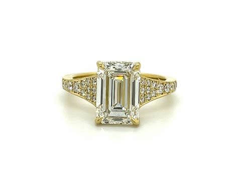 emerald cut engagement ring with plain wedding band 12