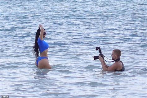 Kim Kardashian Showcases Her Famous Hourglass Curves In A Bright Blue Bikini Crop Top And