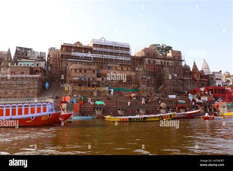 Long View Of Popular Assi Ghat With Several Pilgrims That Stands At