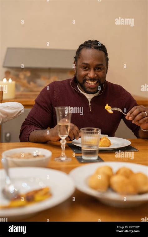 Man Eating Dinner At Home Stock Photo Alamy