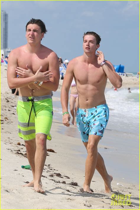 Patrick Schwarzenegger Shirtless Beach Football Photo