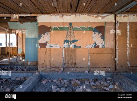 Destroyed abandoned classroom of the old school, wall painting with ...