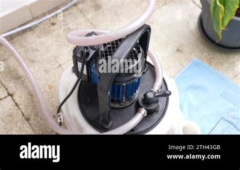 Professional Plumber Man Cleaning Home Boiler And Water Pipes With Hot Acid Solution Circulating
