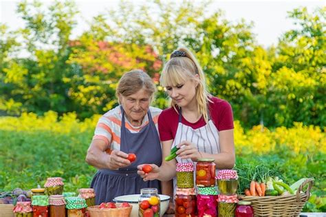 Premium Photo Women With Jar Preserved Vegetables For The Winter