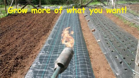 How To Install And Burn Holes In Landscape Weed Barrier Fabric Youtube