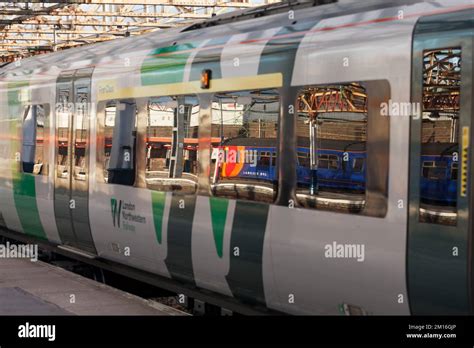 East Midlands Railway class 156 train reflected in the window of a West ...