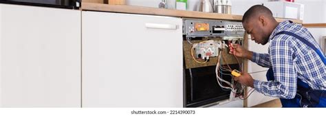 293 African American Repairing Appliances Stock Photos Images